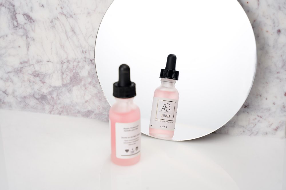 Skincare product brand shoot showcasing the product with its reflection in a mirror, emphasizing the luxury and quality of the skincare item in an elegant and polished setting.